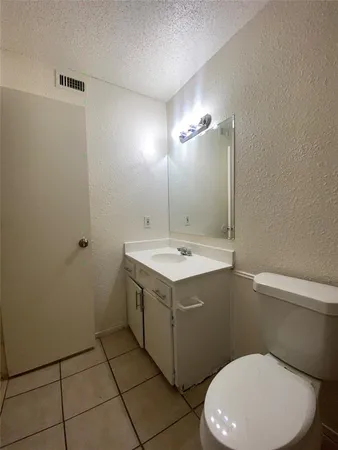 a bathroom with a toilet and shower