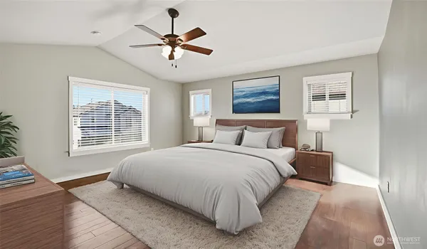 a bedroom with a large bed chandelier and a window