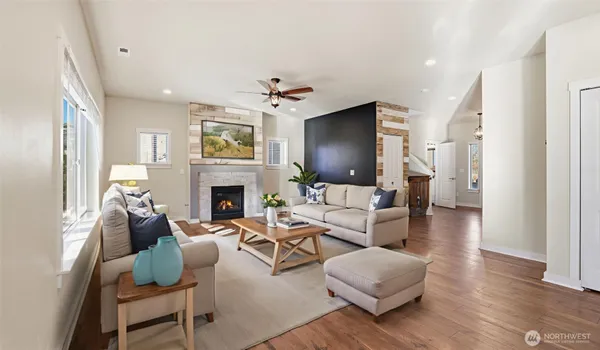 a living room with furniture fireplace and flat screen tv