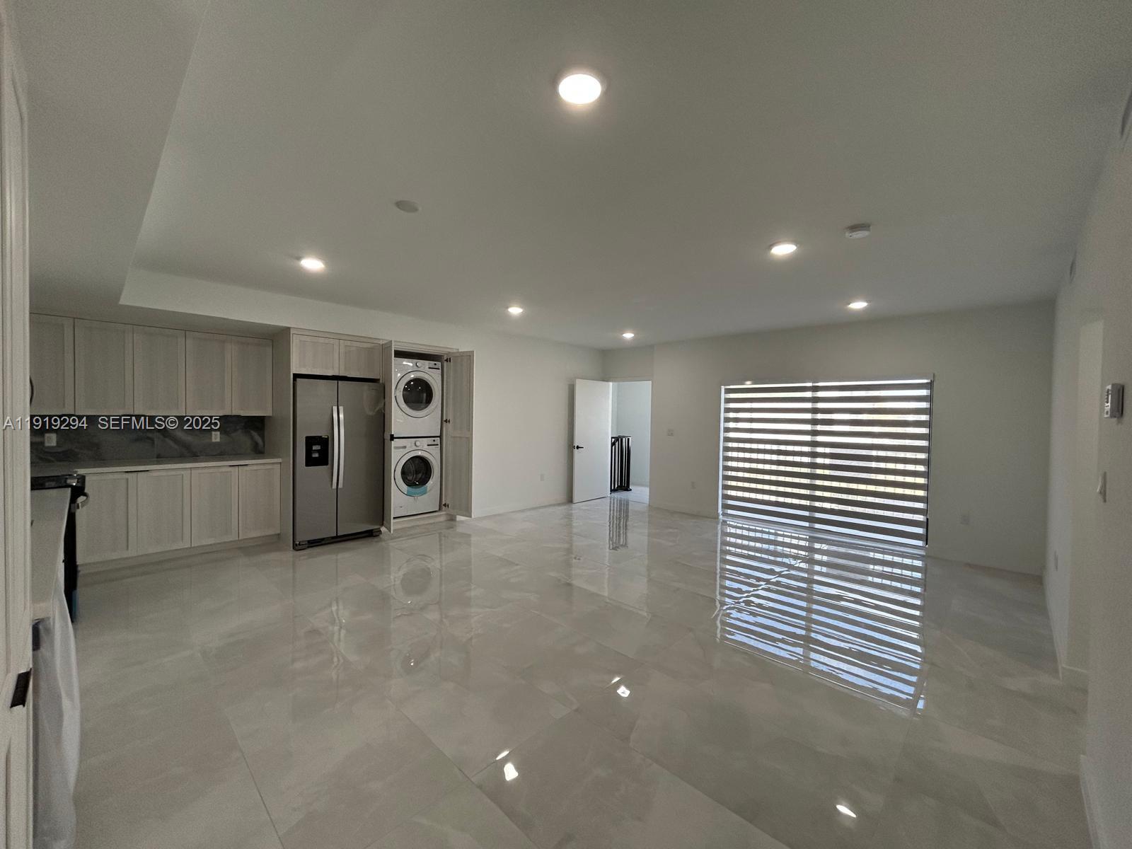 14568 Southwest 261st Terrace, Unit 2 Homestead, FL 33032 - Photo 6 of 22 a view of empty room with wooden floor