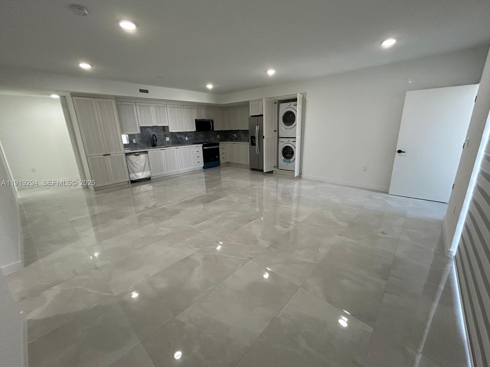 14568 Southwest 261st Terrace, Unit 2 Homestead, FL 33032 - Photo 7 of 22 a view of kitchen with refrigerator and microwave