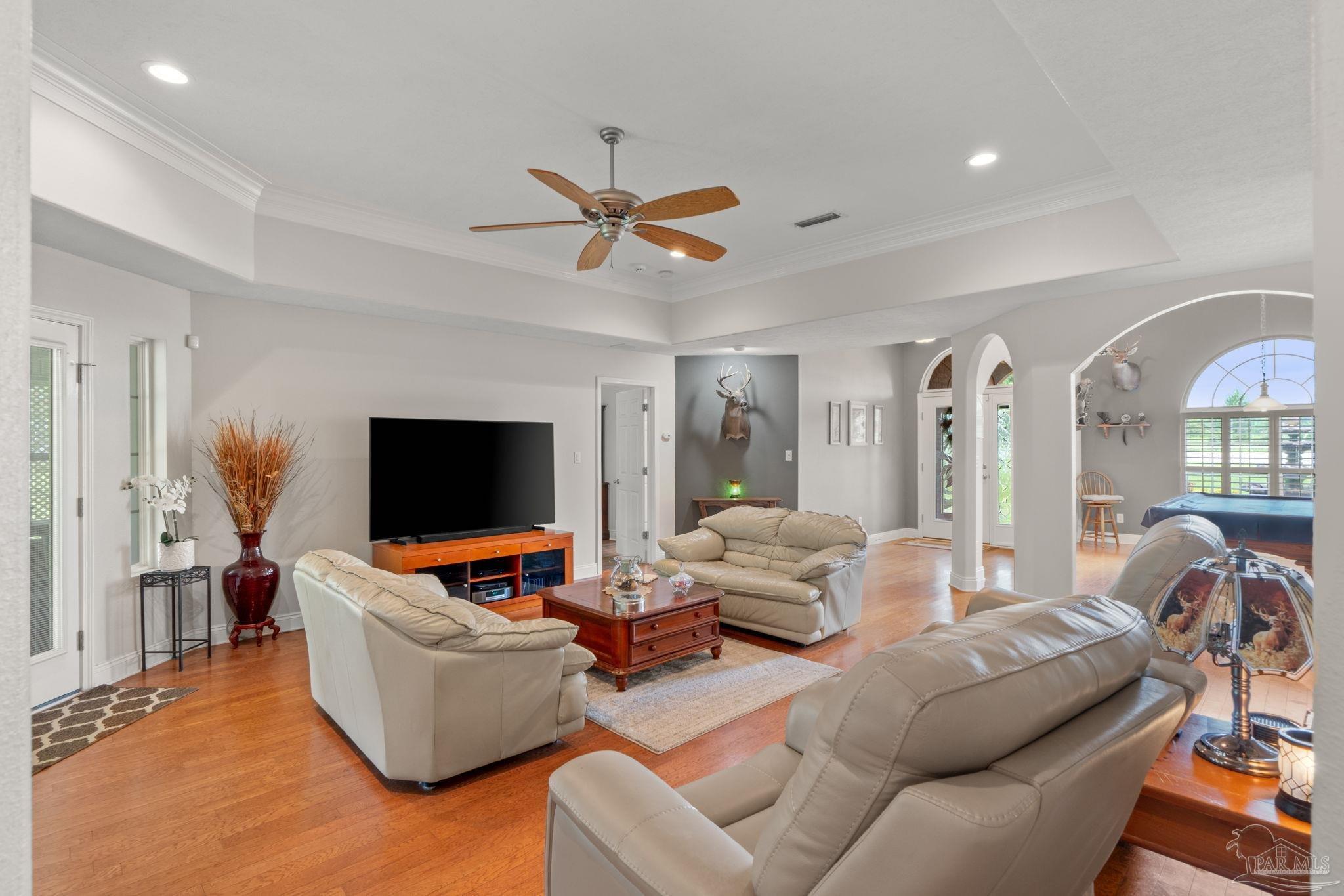 4381 Molino Road Molino, FL 32577 - Photo 14 of 72 a living room with furniture and a flat screen tv
