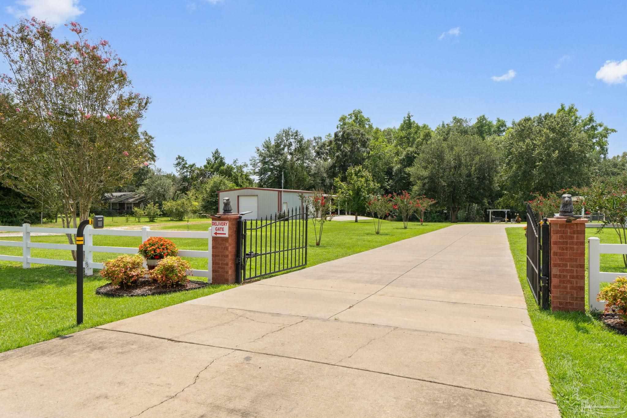 4381 Molino Road Molino, FL 32577 - Photo 2 of 72 a view of a park with large trees