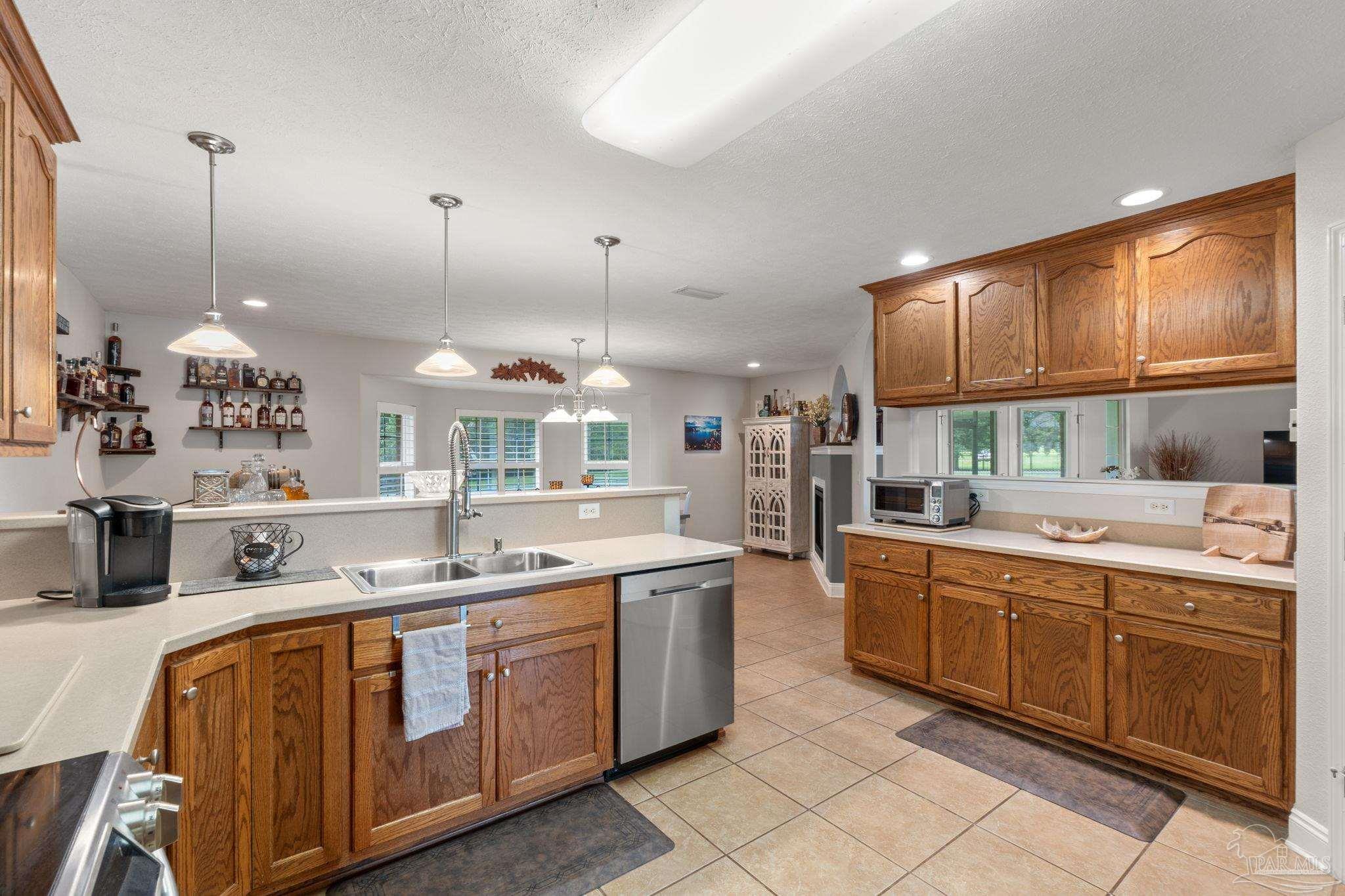 4381 Molino Road Molino, FL 32577 - Photo 22 of 72 a kitchen with a sink and cabinets