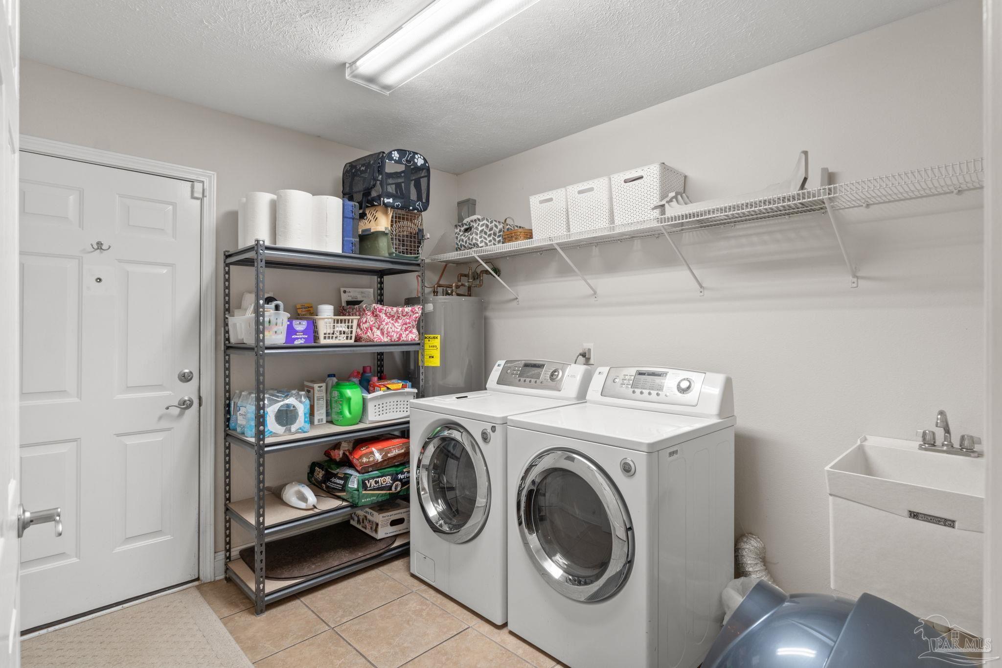 4381 Molino Road Molino, FL 32577 - Photo 24 of 72 a utility room with dryer and washer
