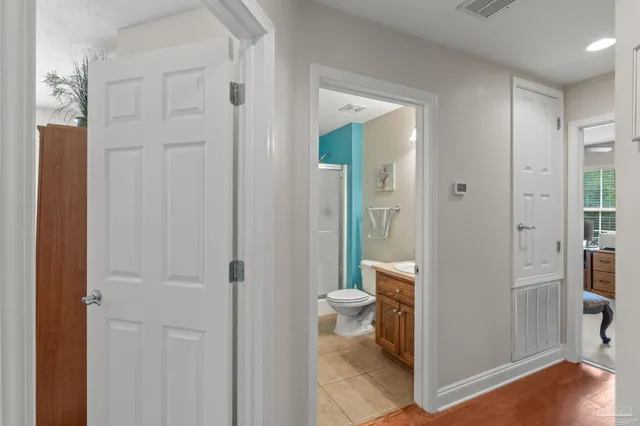 a spacious bathroom with a sink a mirror and a shower