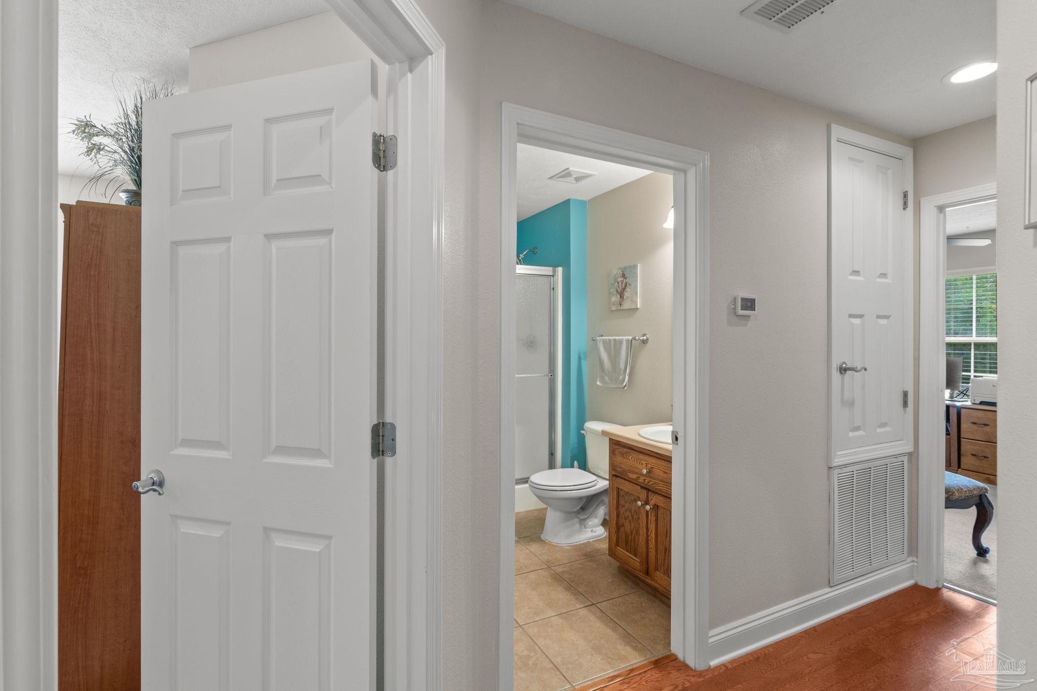 4381 Molino Road Molino, FL 32577 - Photo 25 of 72 a bathroom with a sink and a toilet