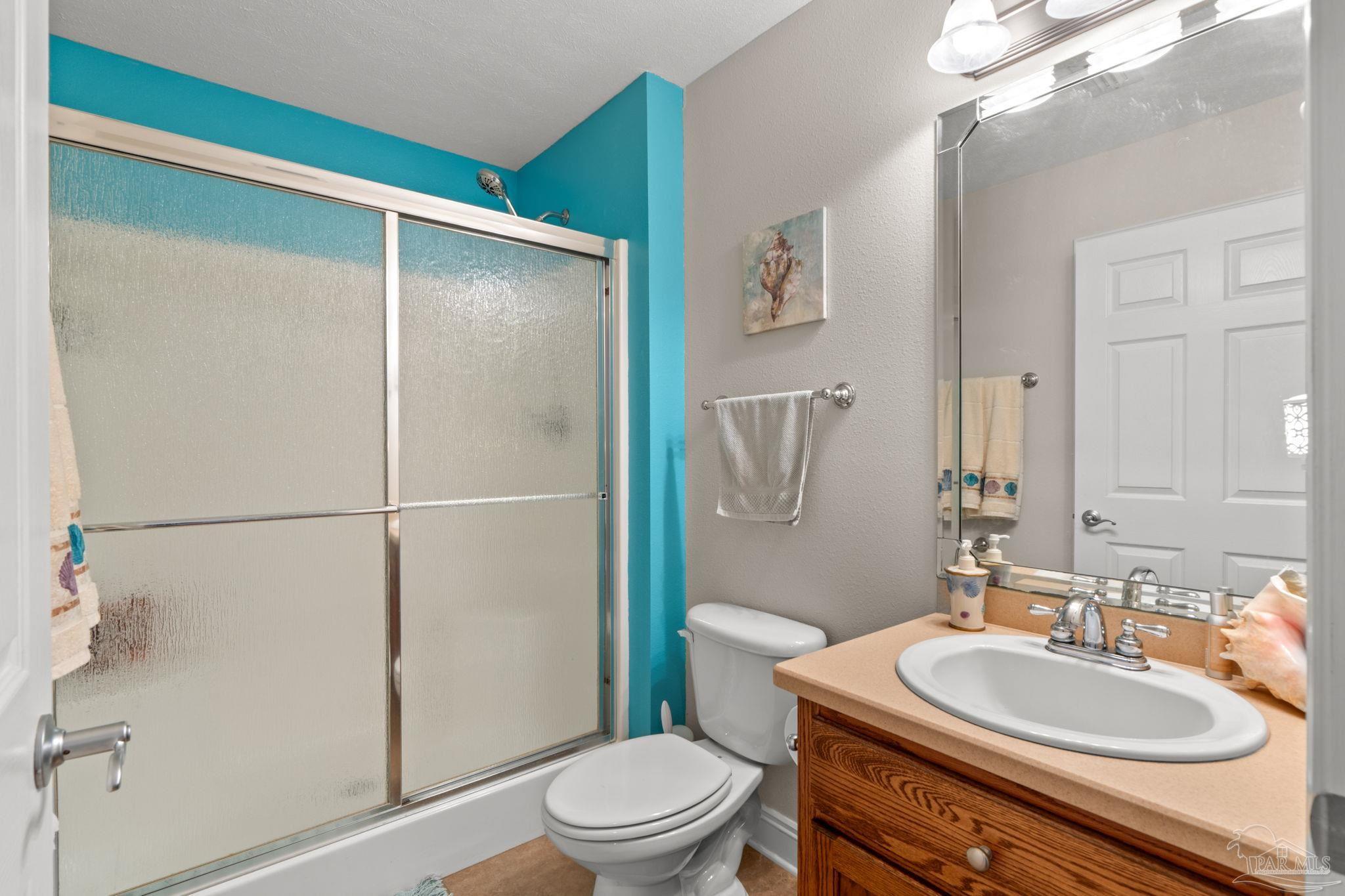 4381 Molino Road Molino, FL 32577 - Photo 28 of 72 a bathroom with a sink toilet and shower