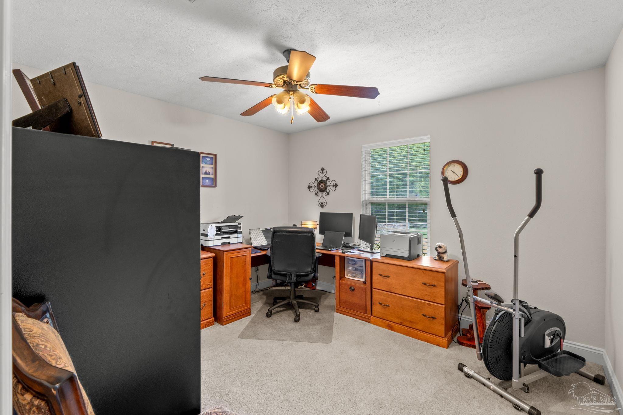 4381 Molino Road Molino, FL 32577 - Photo 29 of 72 a view of a workspace with furniture and a window