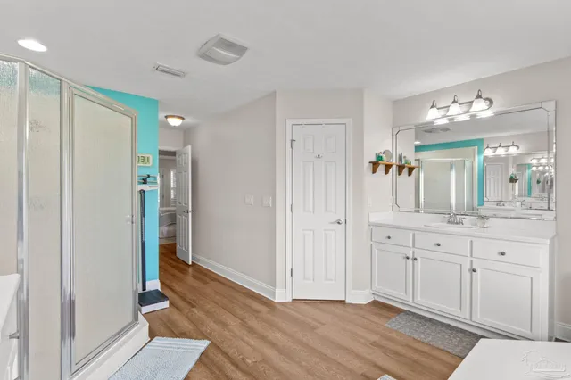 a view of green field with trees in the background