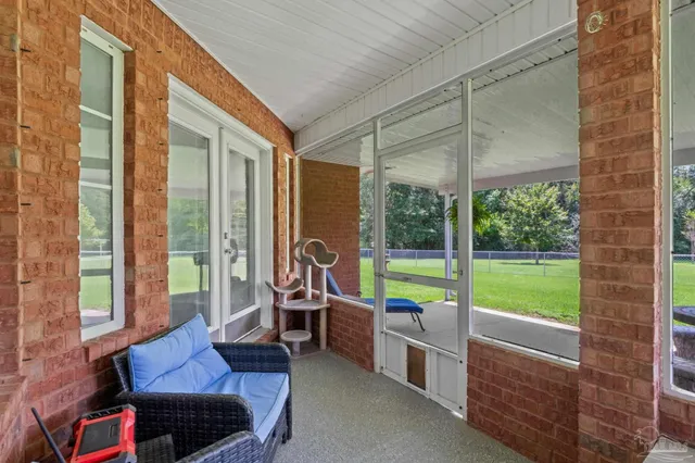 a view of field with trees in the background