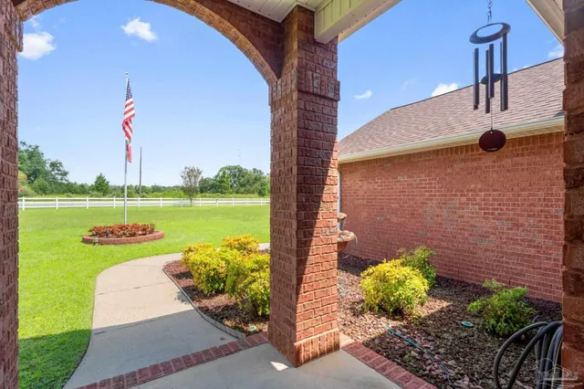 a living room with fireplace furniture and a wooden floor