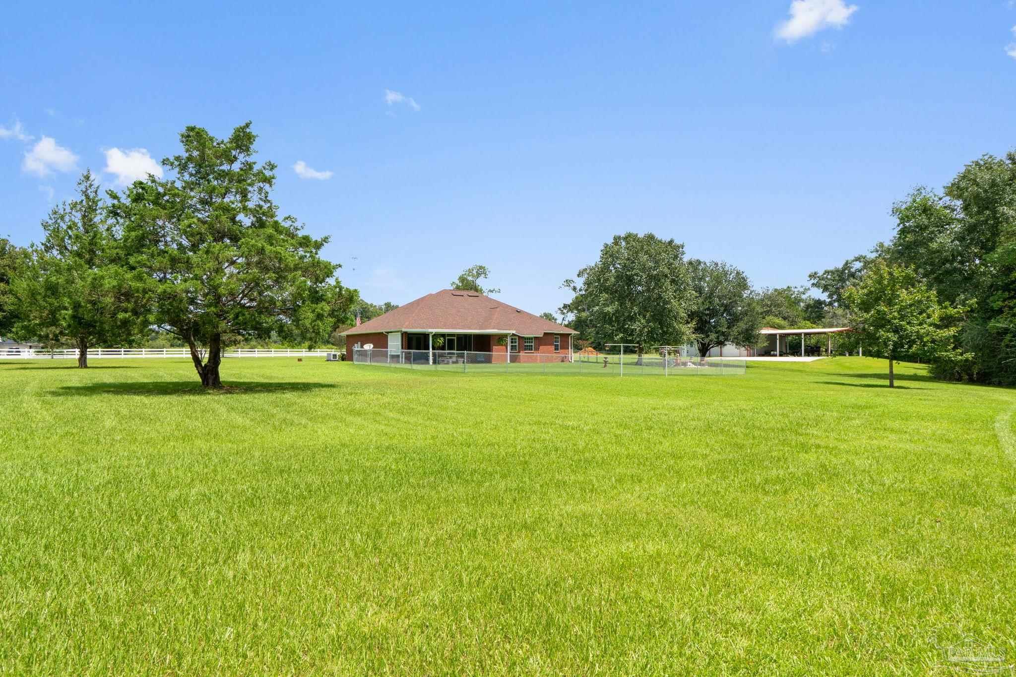 4381 Molino Road Molino, FL 32577 - Photo 54 of 72 a view of a house with a yard