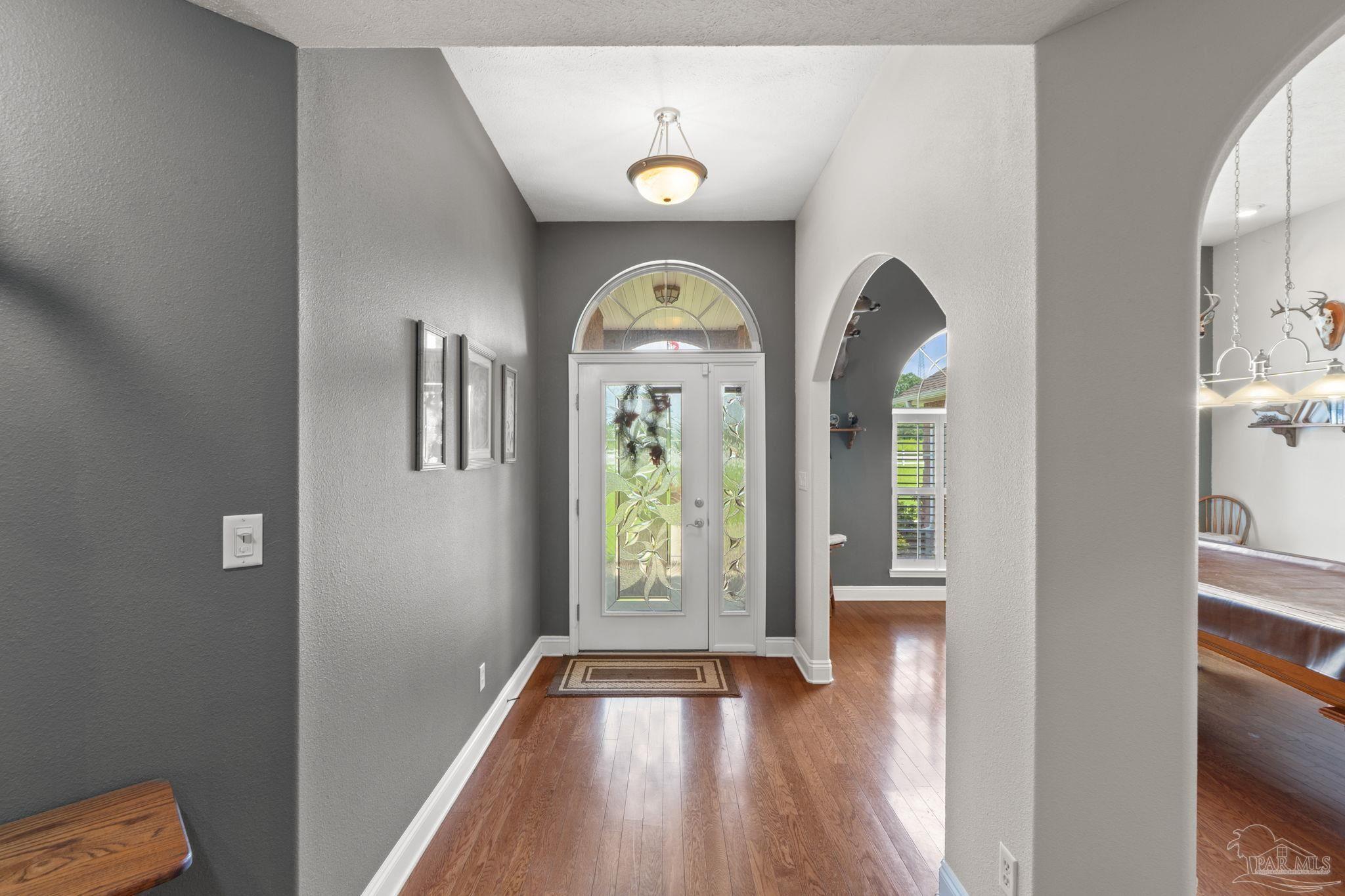 4381 Molino Road Molino, FL 32577 - Photo 6 of 72 a view of an entryway with wooden floor