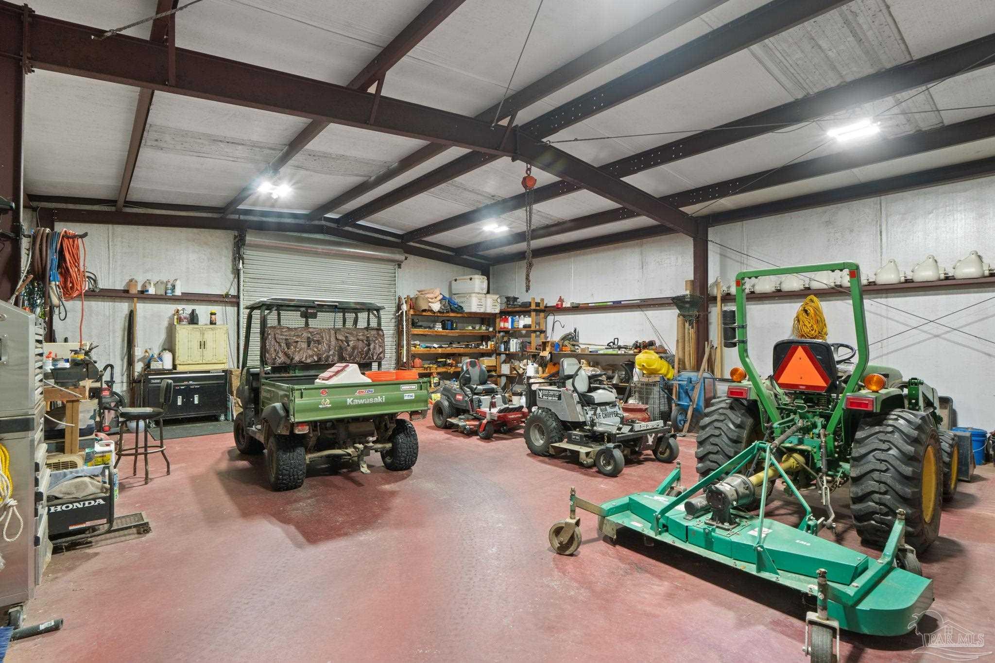 4381 Molino Road Molino, FL 32577 - Photo 66 of 72 a view of a storage room with lots of stuff