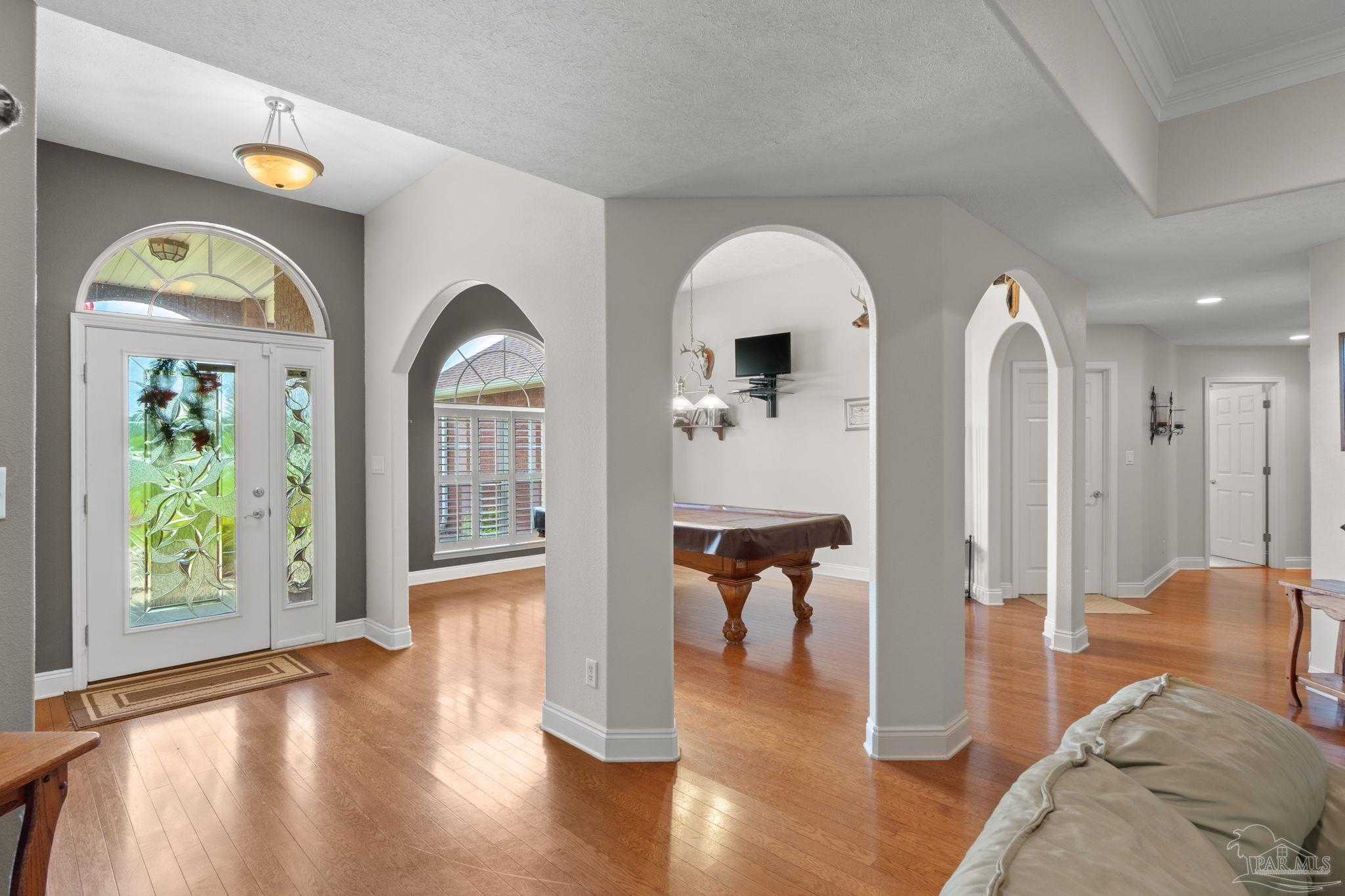 4381 Molino Road Molino, FL 32577 - Photo 8 of 72 a living room with furniture and a large window