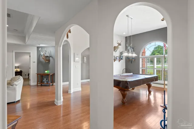 a living room with furniture fireplace and flat screen tv
