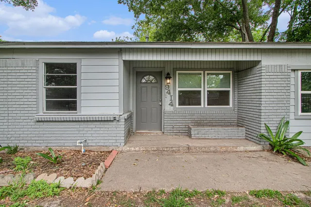 a house with a tree in the background