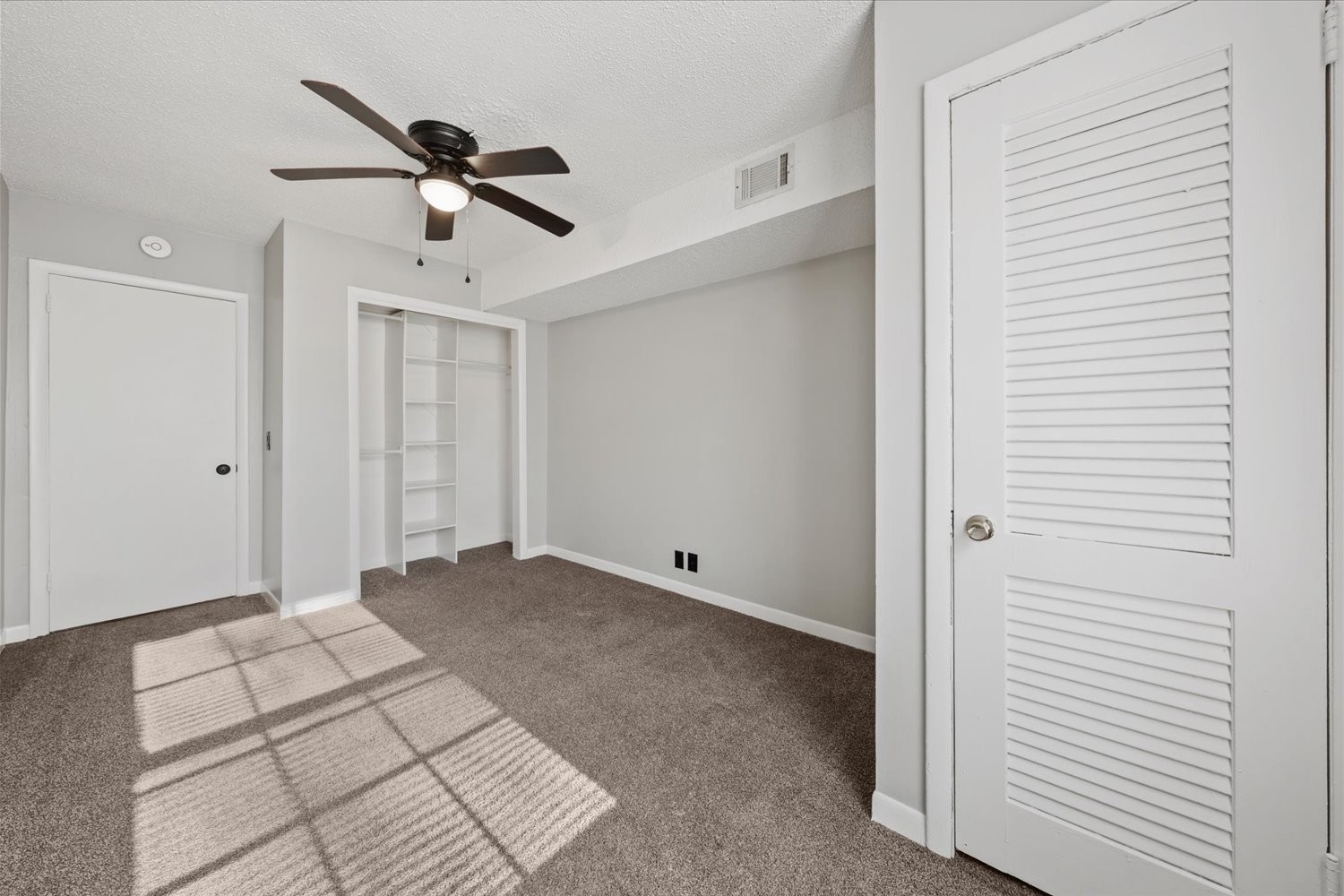 441 Harding Place, Unit A12 Nashville, TN 37211 - Photo 12 of 21 a view of empty room with stairs and a ceiling fan