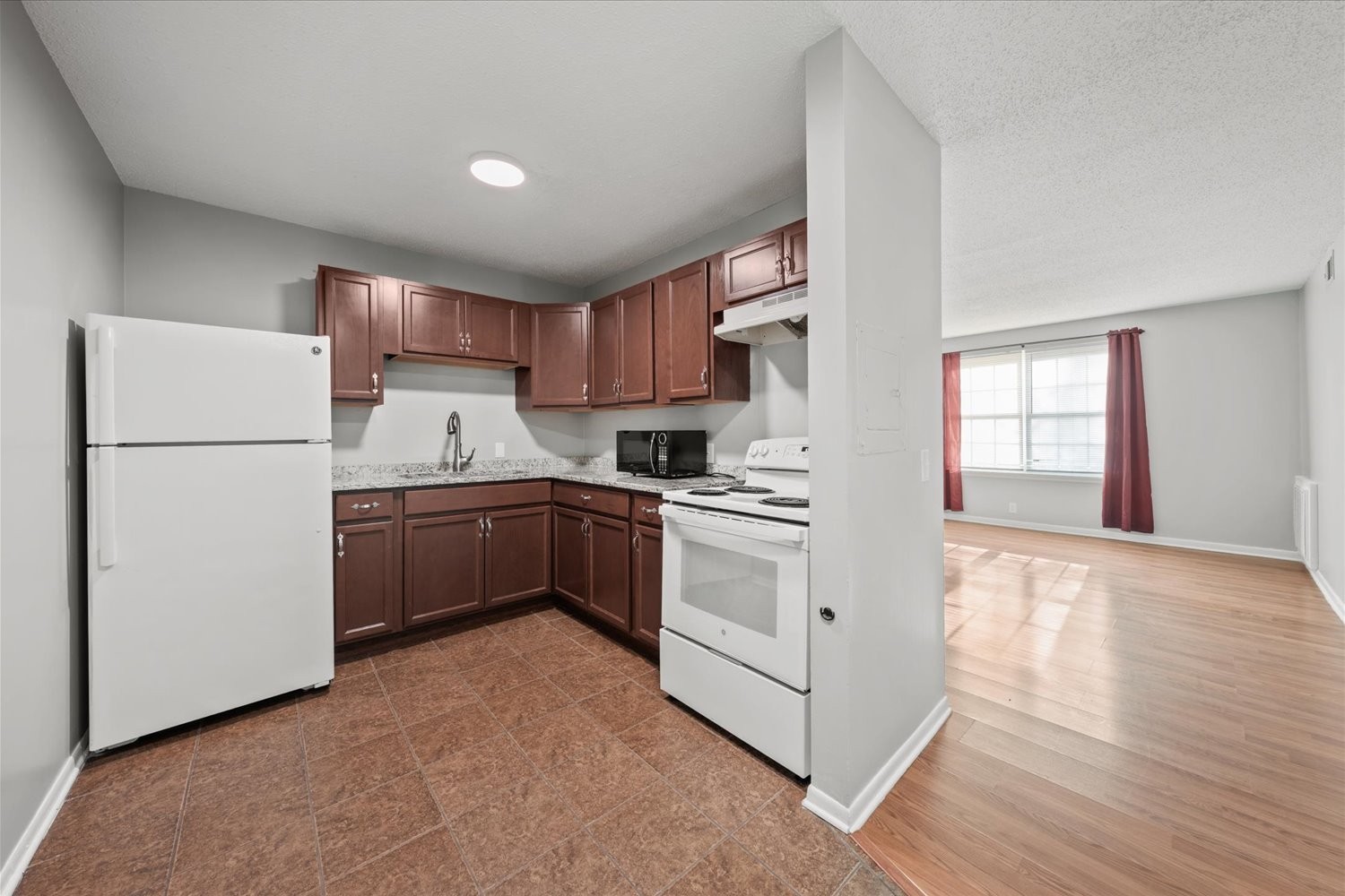 441 Harding Place, Unit A12 Nashville, TN 37211 - Photo 5 of 21 a kitchen with a refrigerator sink and cabinets