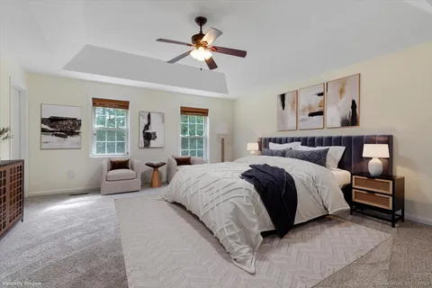 a spacious bedroom with a bed and window