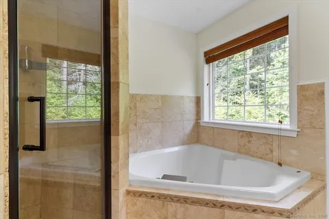 a bath tub sitting next to a window