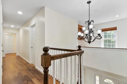 a view of a hallway with a chandelier