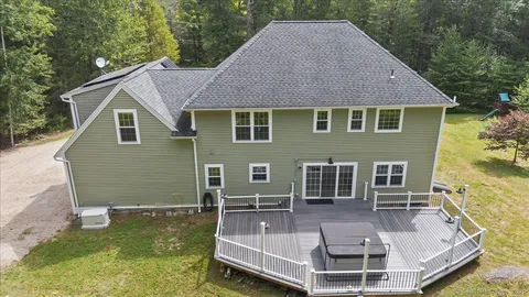 a aerial view of a house with a yard