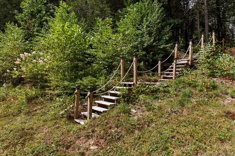 a backyard of a house with lots of green space
