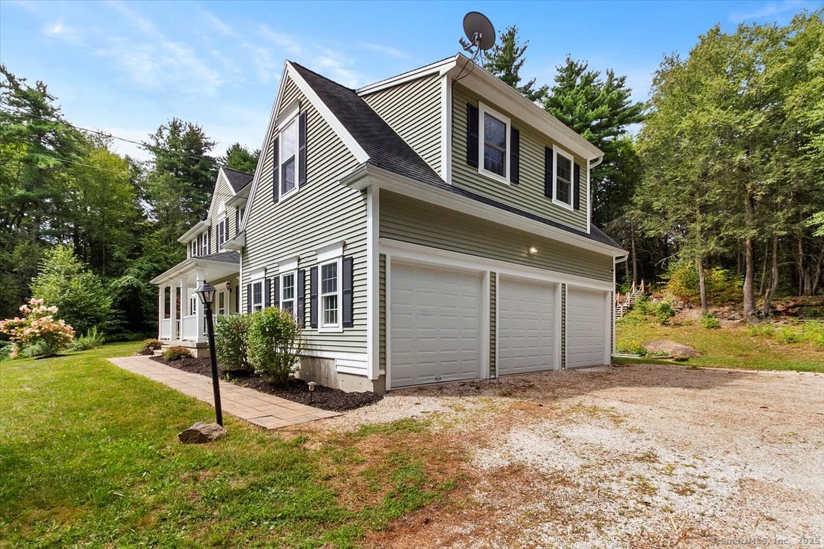 151 Losaw Road Winchester, CT 06021 - Photo 4 of 40 a house that has a lot of windows in it