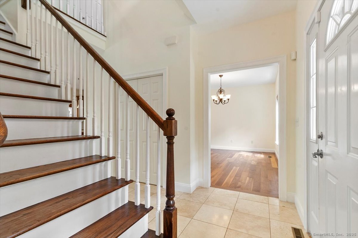151 Losaw Road Winchester, CT 06021 - Photo 6 of 40 a view of entryway with wooden floor and stairs