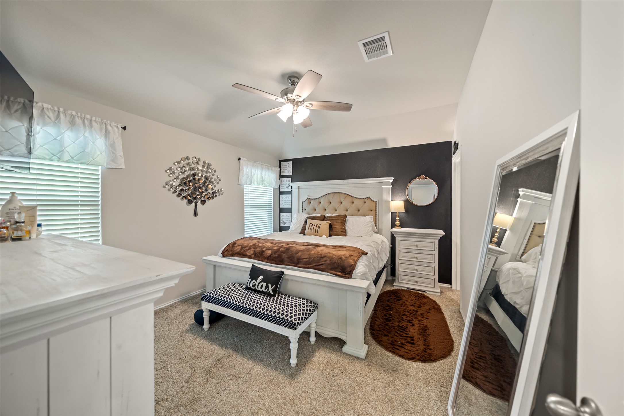 22806 Spruce Summit Trail Spring, TX 77373 - Photo 13 of 31 a bedroom with a bed and a chandelier