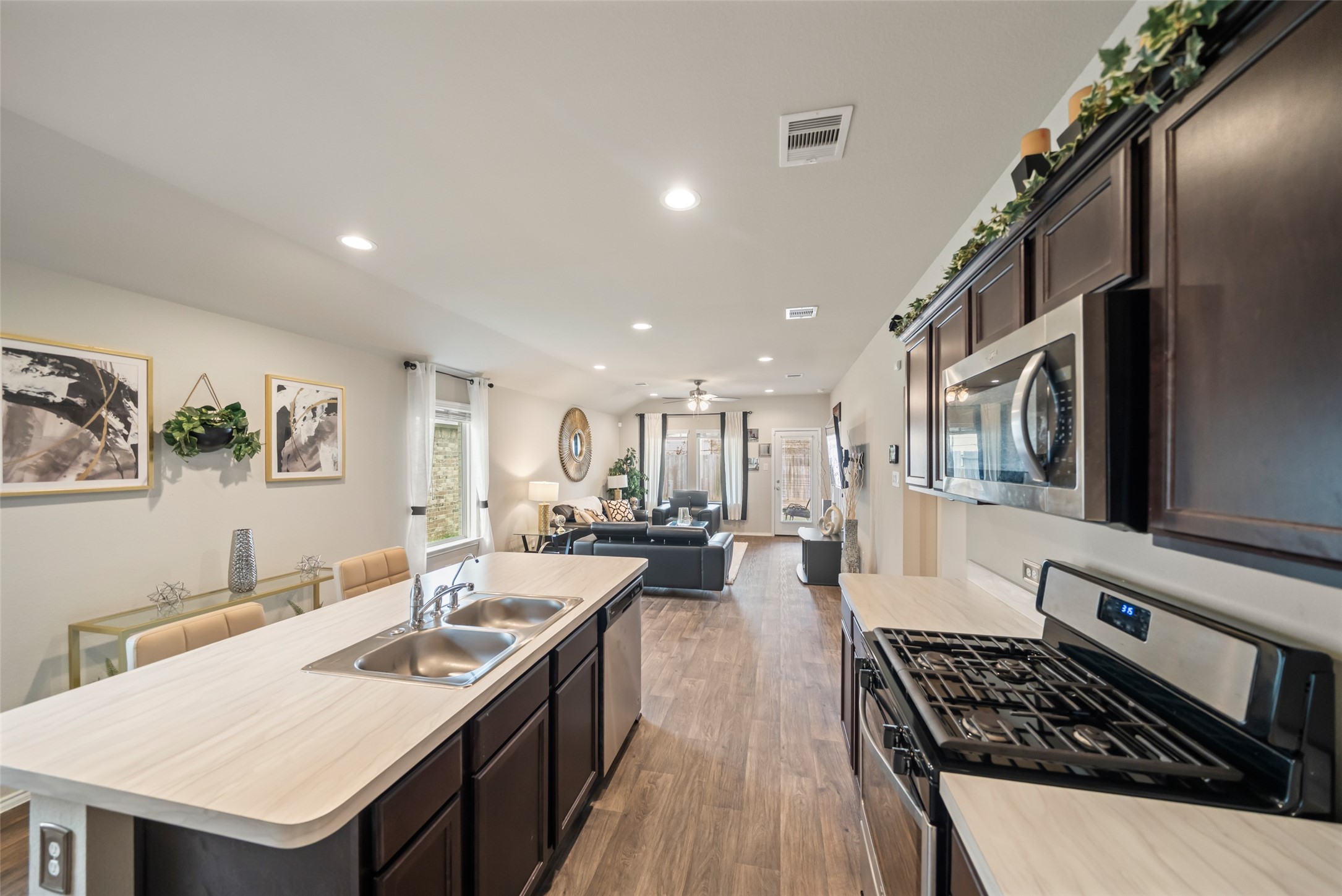 22806 Spruce Summit Trail Spring, TX 77373 - Photo 15 of 31 a kitchen with stainless steel appliances granite countertop a sink stove and refrigerator