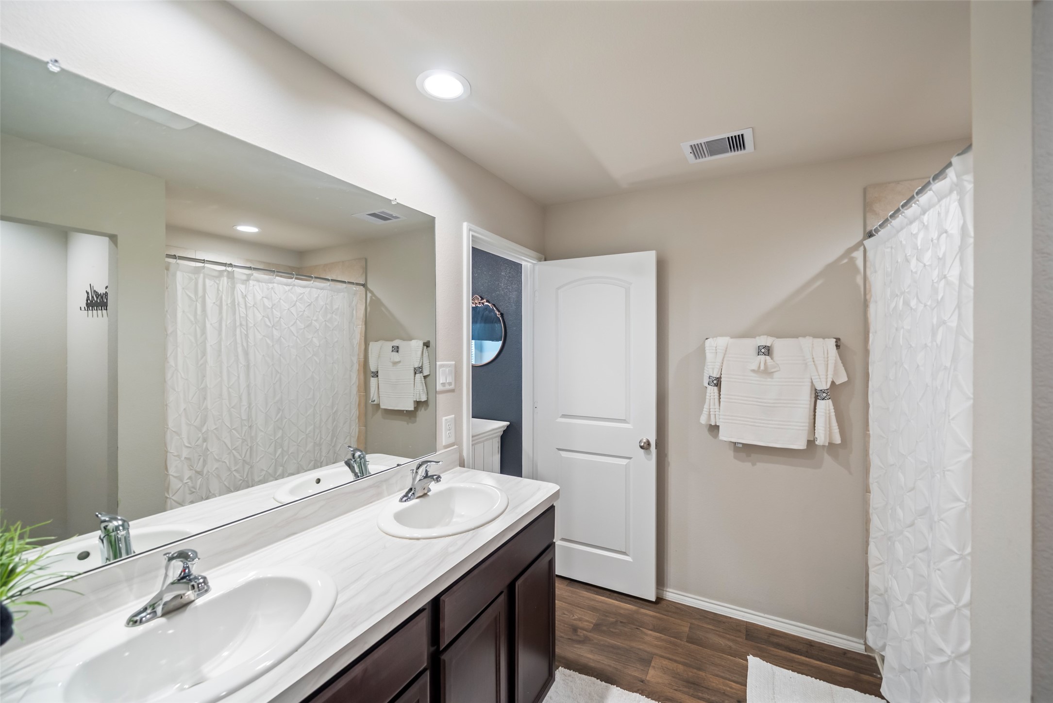 22806 Spruce Summit Trail Spring, TX 77373 - Photo 17 of 31 a bathroom with a sink double vanity and a shower