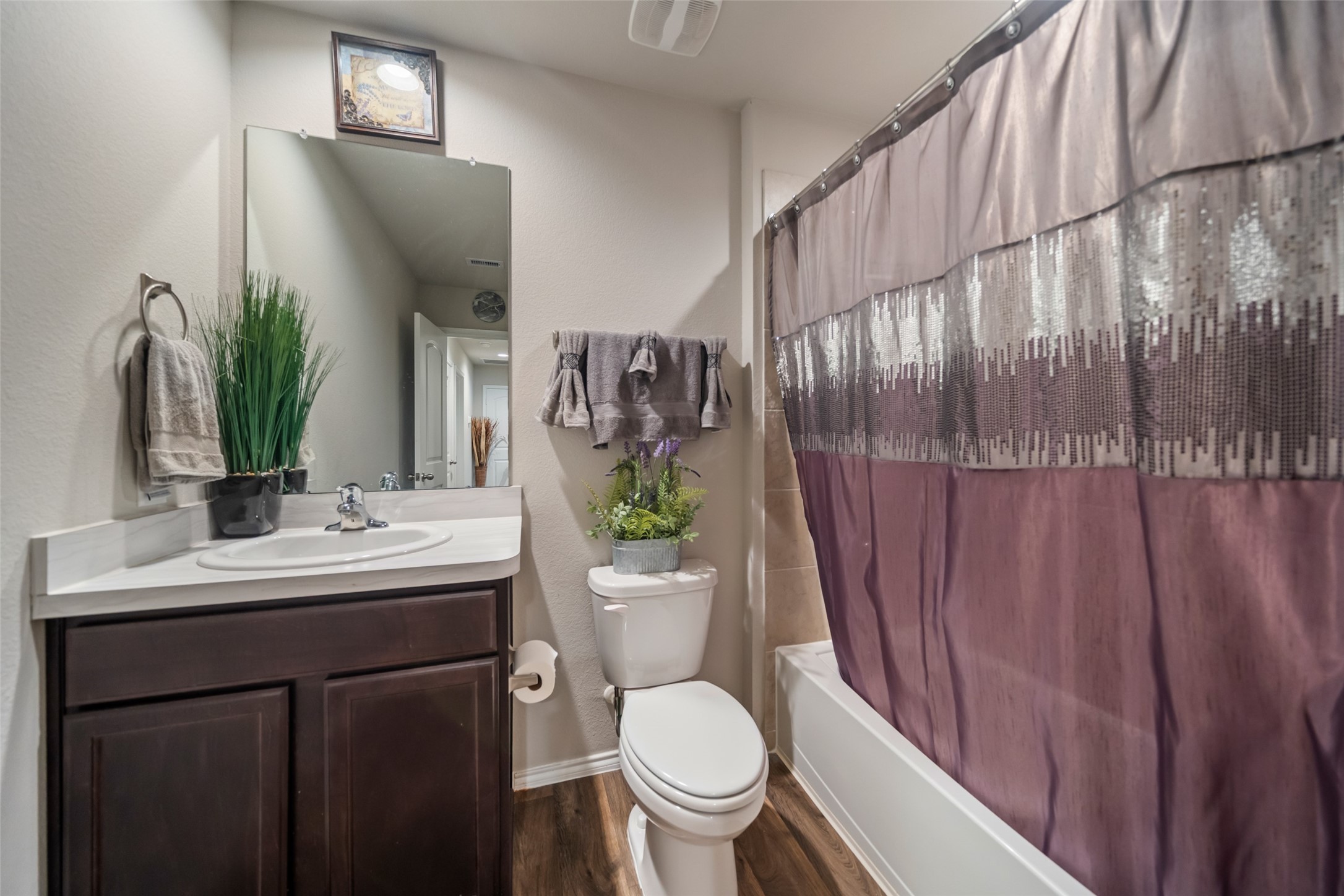 22806 Spruce Summit Trail Spring, TX 77373 - Photo 19 of 31 a bathroom with a toilet a sink and mirror