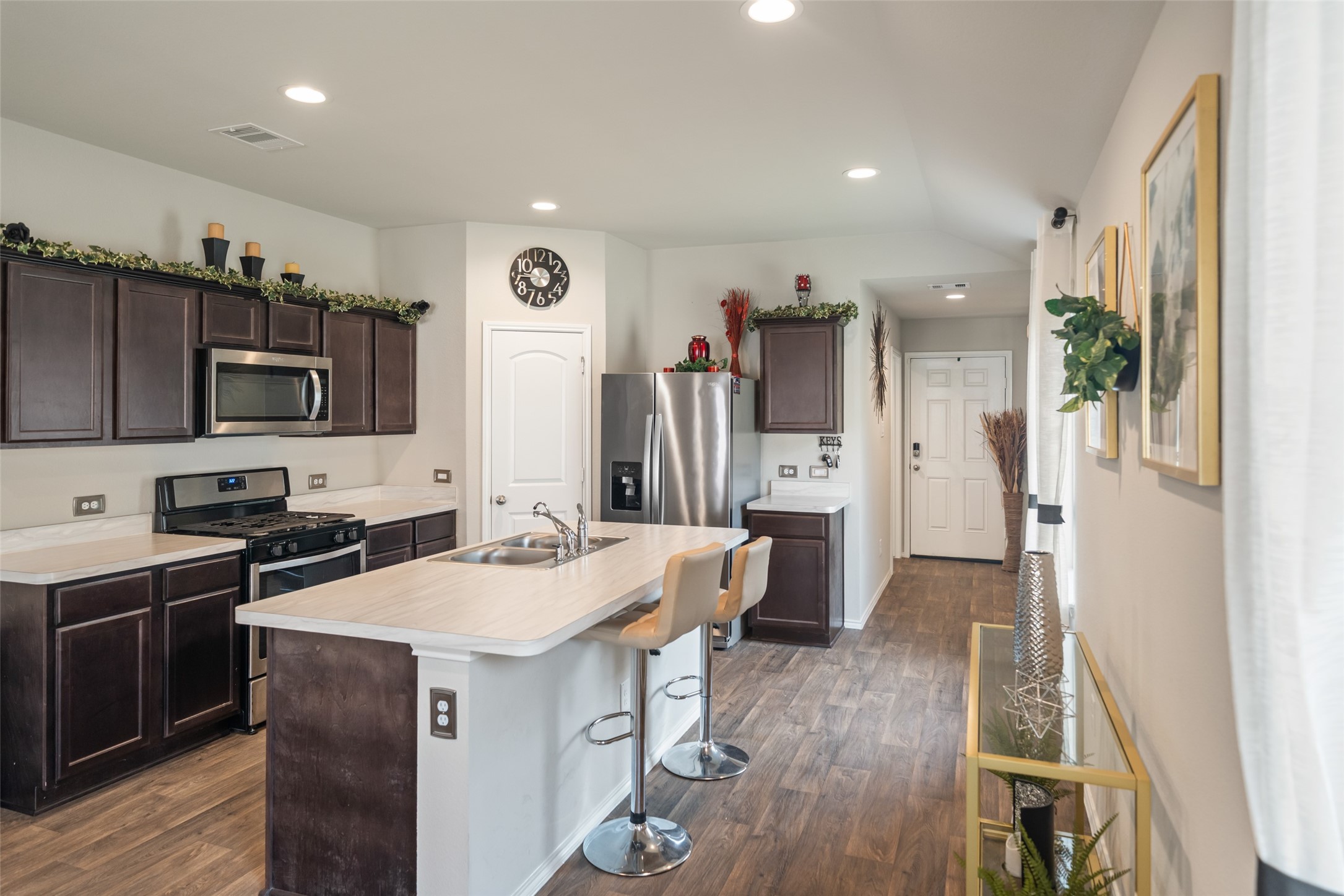 22806 Spruce Summit Trail Spring, TX 77373 - Photo 2 of 31 a kitchen with stainless steel appliances a sink stove and refrigerator
