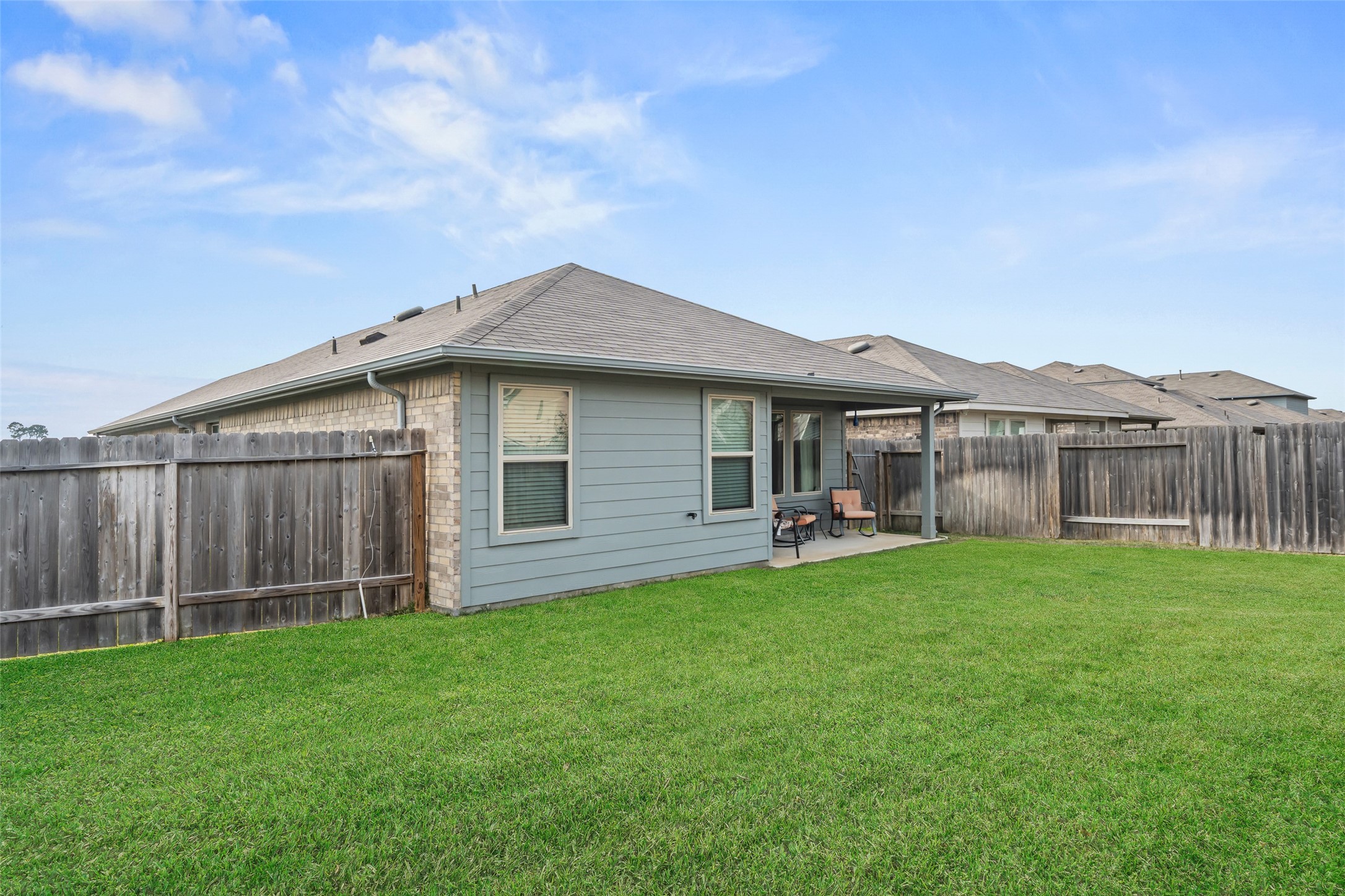 22806 Spruce Summit Trail Spring, TX 77373 - Photo 24 of 31 a backyard of a house with table and chairs