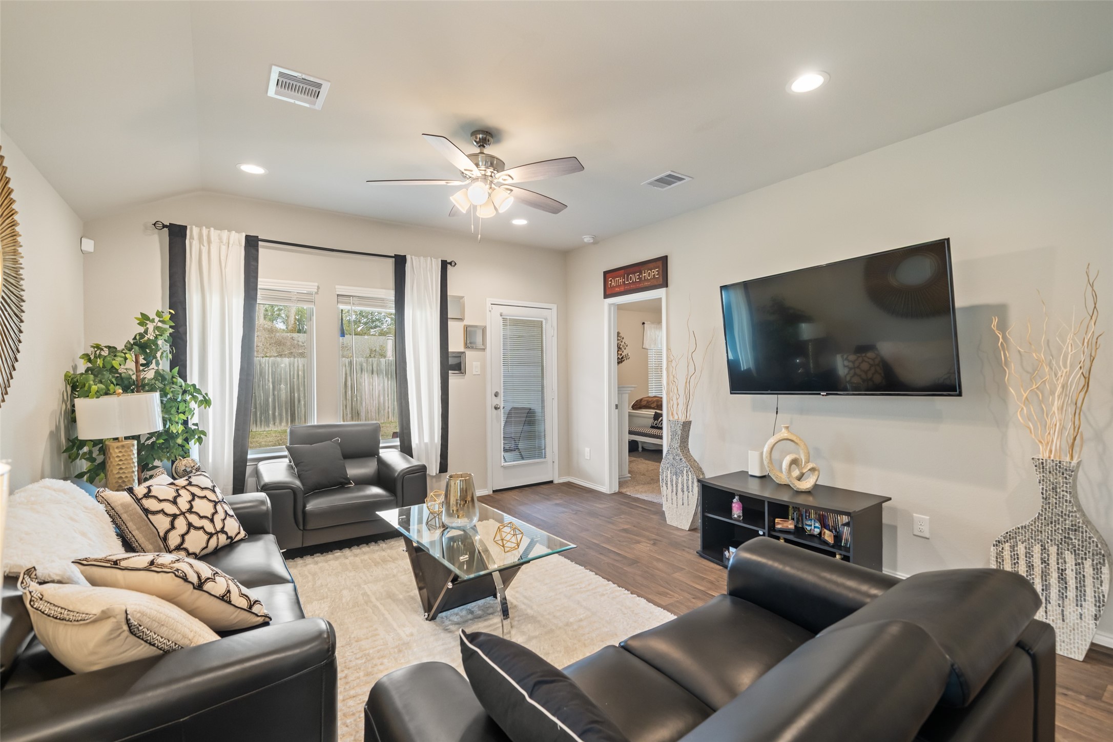22806 Spruce Summit Trail Spring, TX 77373 - Photo 7 of 31 a living room with furniture and a flat screen tv