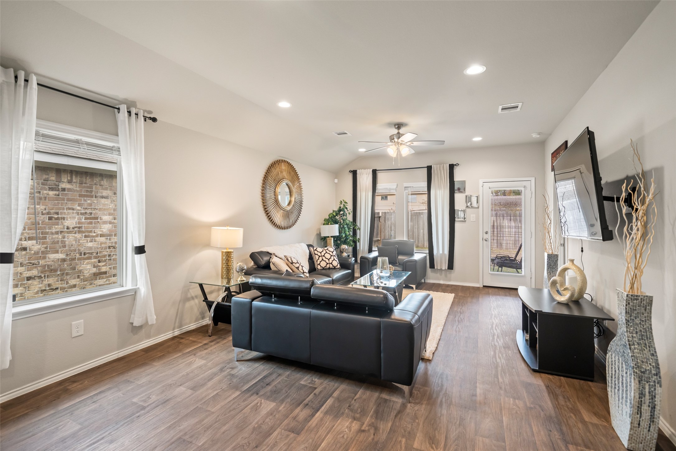 22806 Spruce Summit Trail Spring, TX 77373 - Photo 9 of 31 a living room with furniture a large window and wooden floor