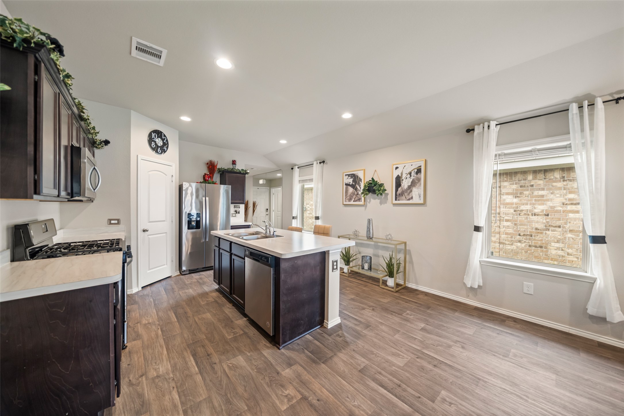 22806 Spruce Summit Trail Spring, TX 77373 - Photo 10 of 31 a large kitchen with a lot of counter space and a wooden floor