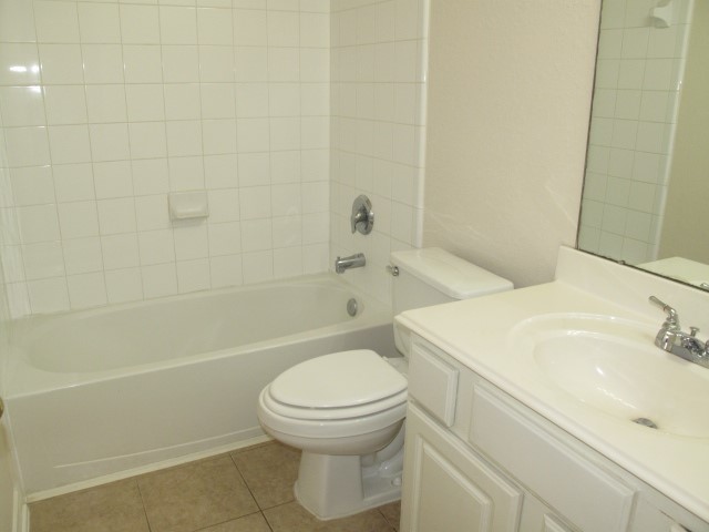 3142 Rendezvous Court Spring, TX 77373 - Photo 11 of 30 a bathroom with a sink a toilet and shower