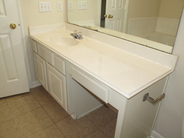 3142 Rendezvous Court Spring, TX 77373 - Photo 20 of 30 a bathroom with a sink and a mirror