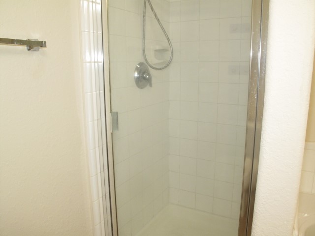 3142 Rendezvous Court Spring, TX 77373 - Photo 22 of 30 a bathroom with a glass shower door