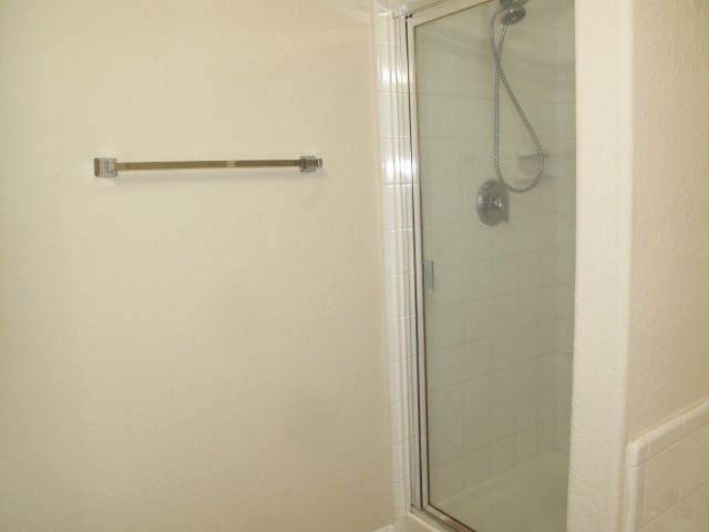 3142 Rendezvous Court Spring, TX 77373 - Photo 23 of 30 a bathroom with a glass shower door