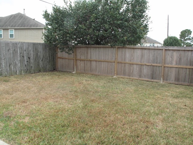 3142 Rendezvous Court Spring, TX 77373 - Photo 26 of 30 a view of backyard and wooden fence