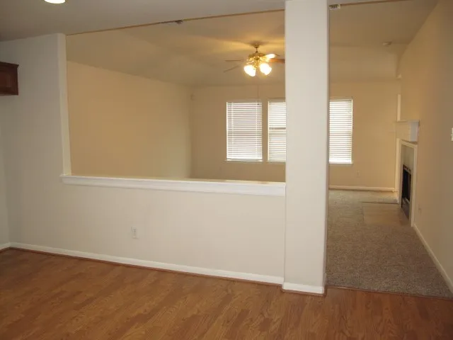 a kitchen with a sink a stove and cabinets