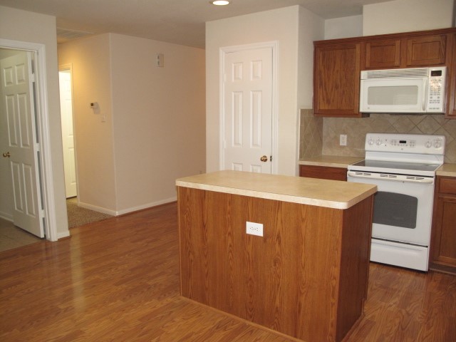 3142 Rendezvous Court Spring, TX 77373 - Photo 6 of 30 a view of washer and dryer with wooden floor