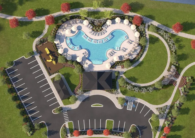 an aerial view of a house a yard and a fire pit