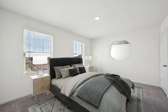 a bedroom with bed and a window