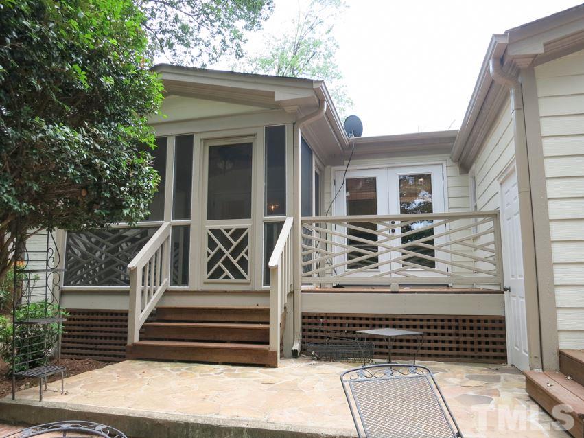 704 Currituck Drive Raleigh, NC 27609 - Photo 22 of 25 a view of a house with a door and wooden floor
